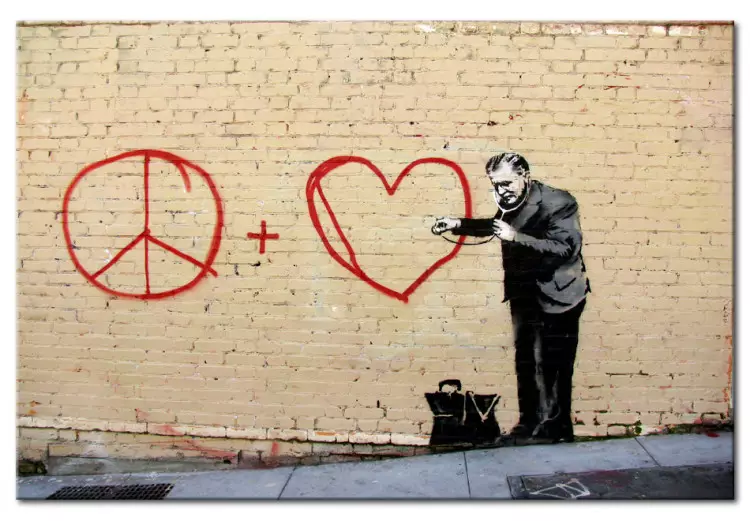 Pazifistischer Arzt (Banksy) - Mann als Street Art auf Backsteinwand